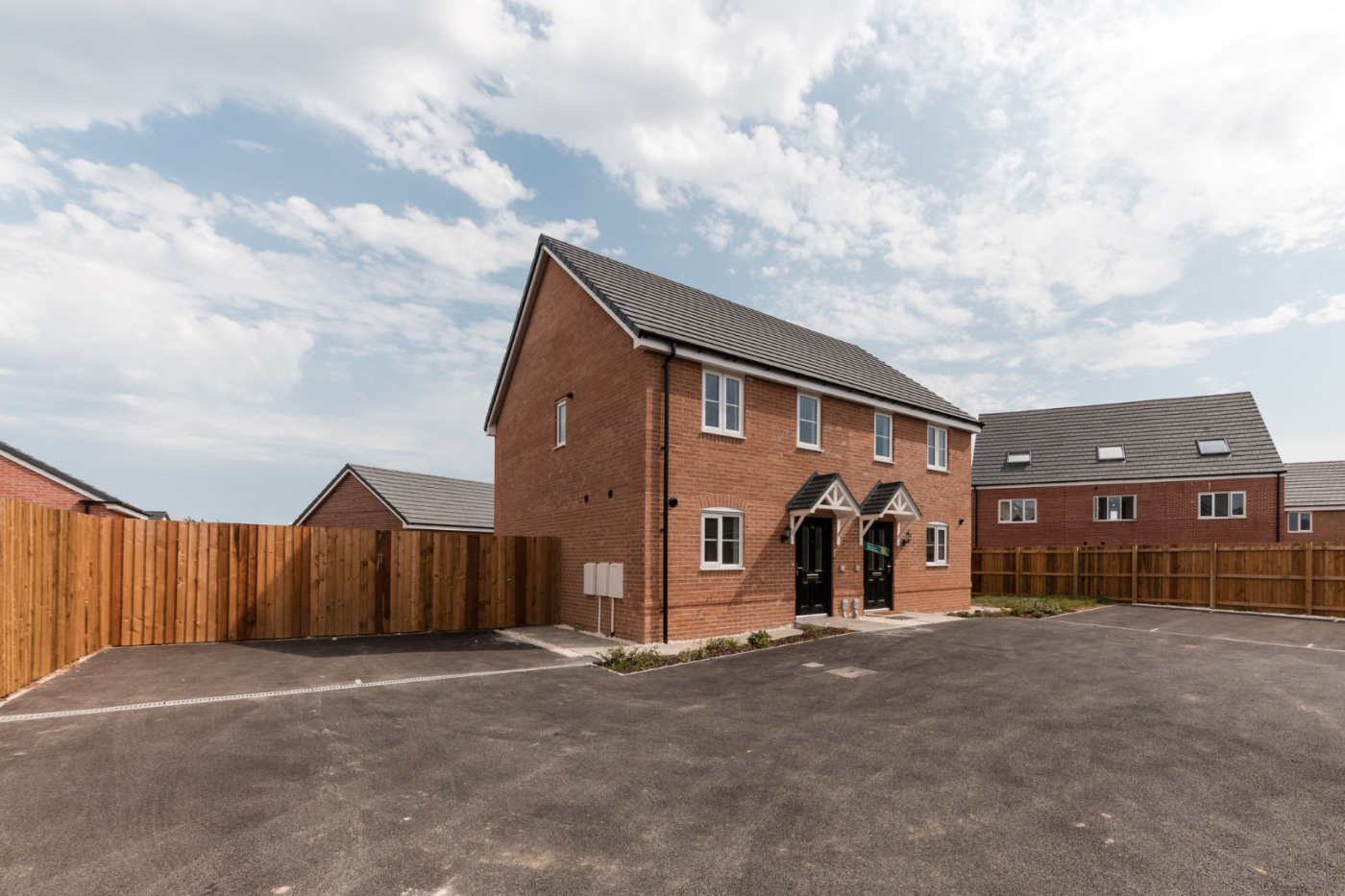 Side view of a semi detached house with parking