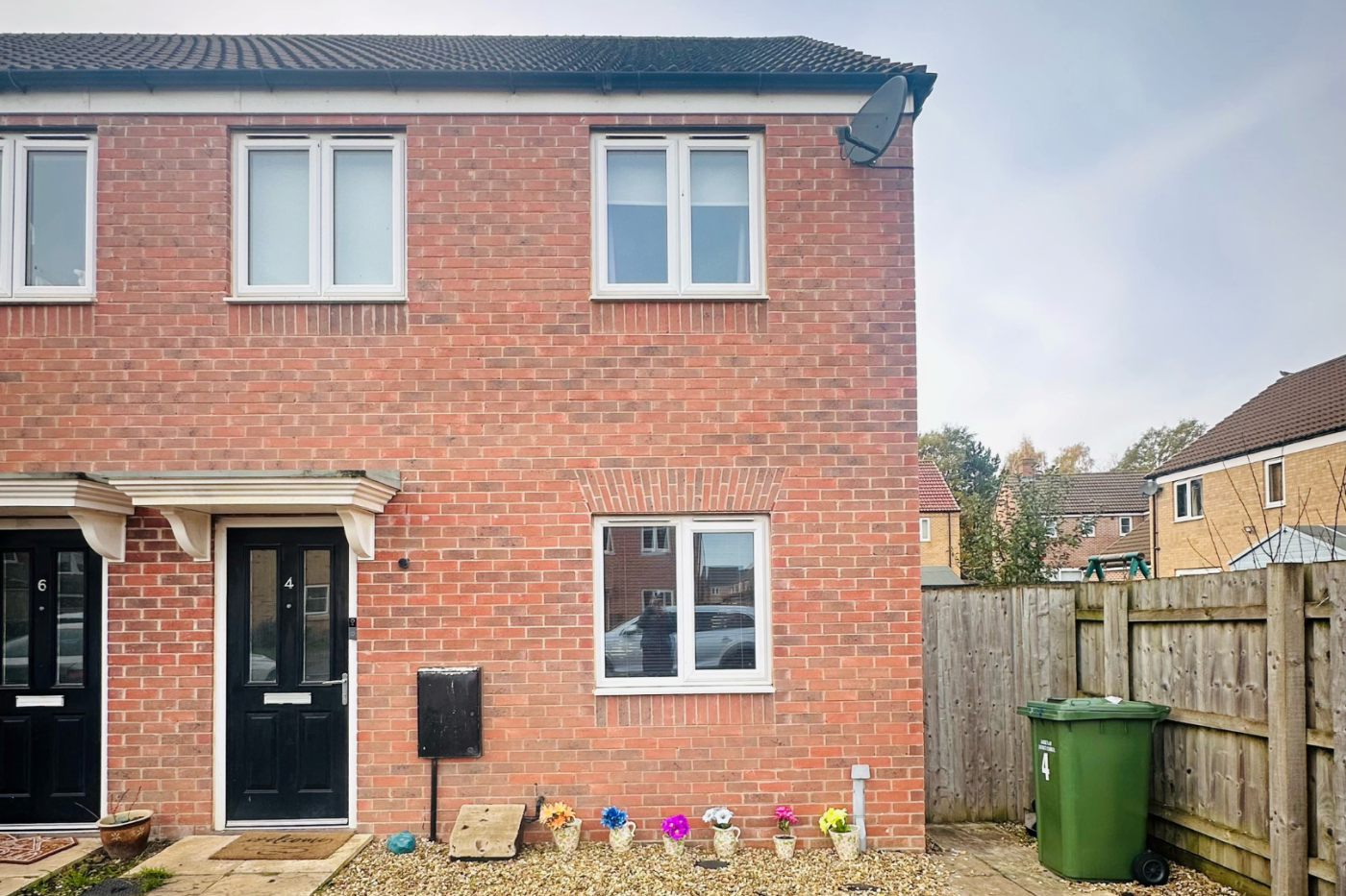 Front of a semi detached house with a driveway