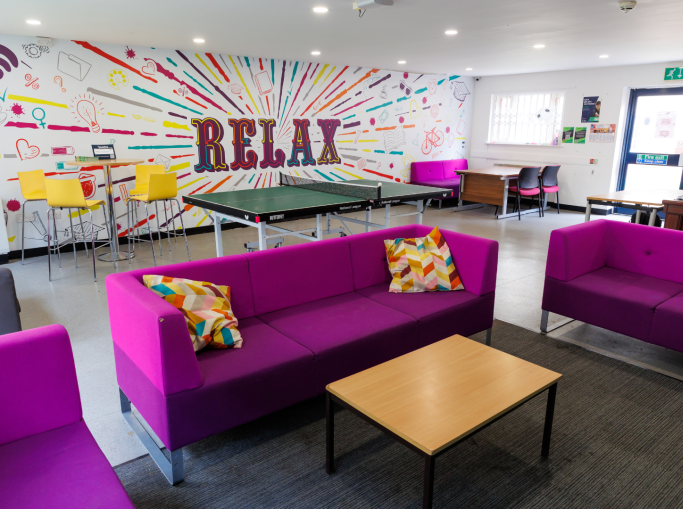 Common room with sofas, games and tables