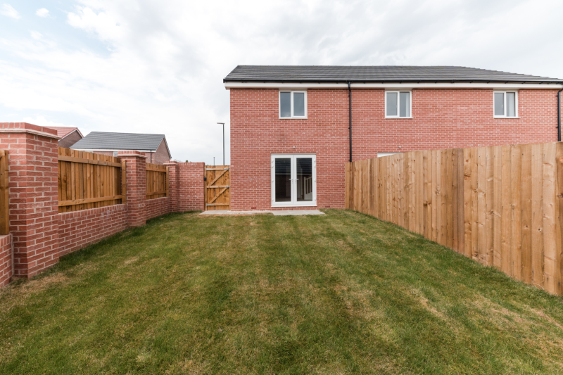 garden looking towards a patio and house