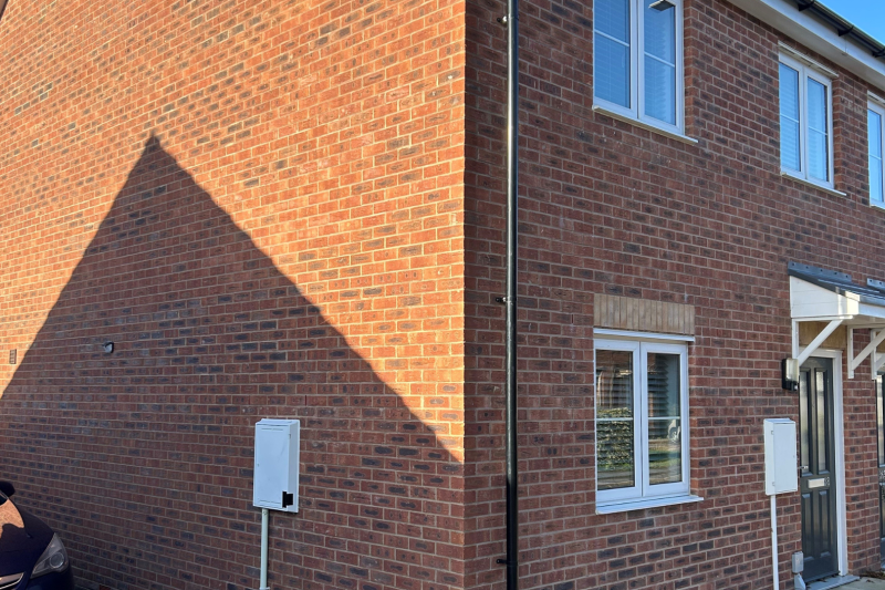 Side of a semi-detached house with a driveway