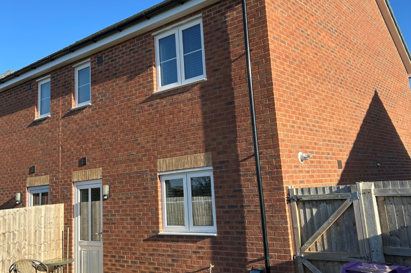 Back of a semi detached house with a garden