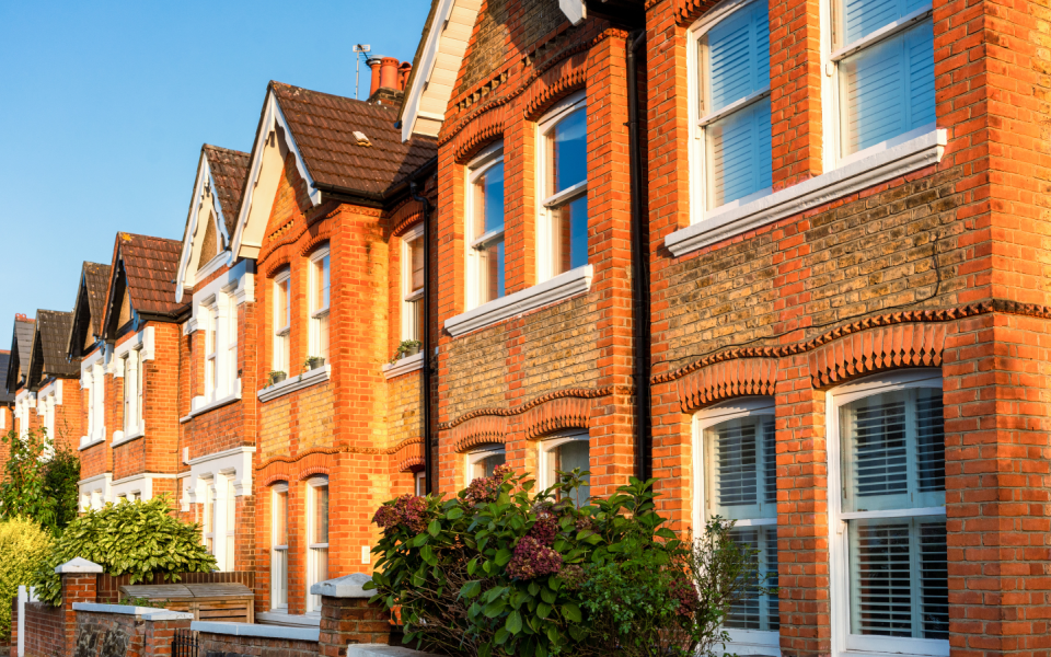 A row of terraced houses in a street